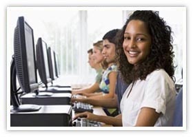 College students learning how to do research in a computer lab